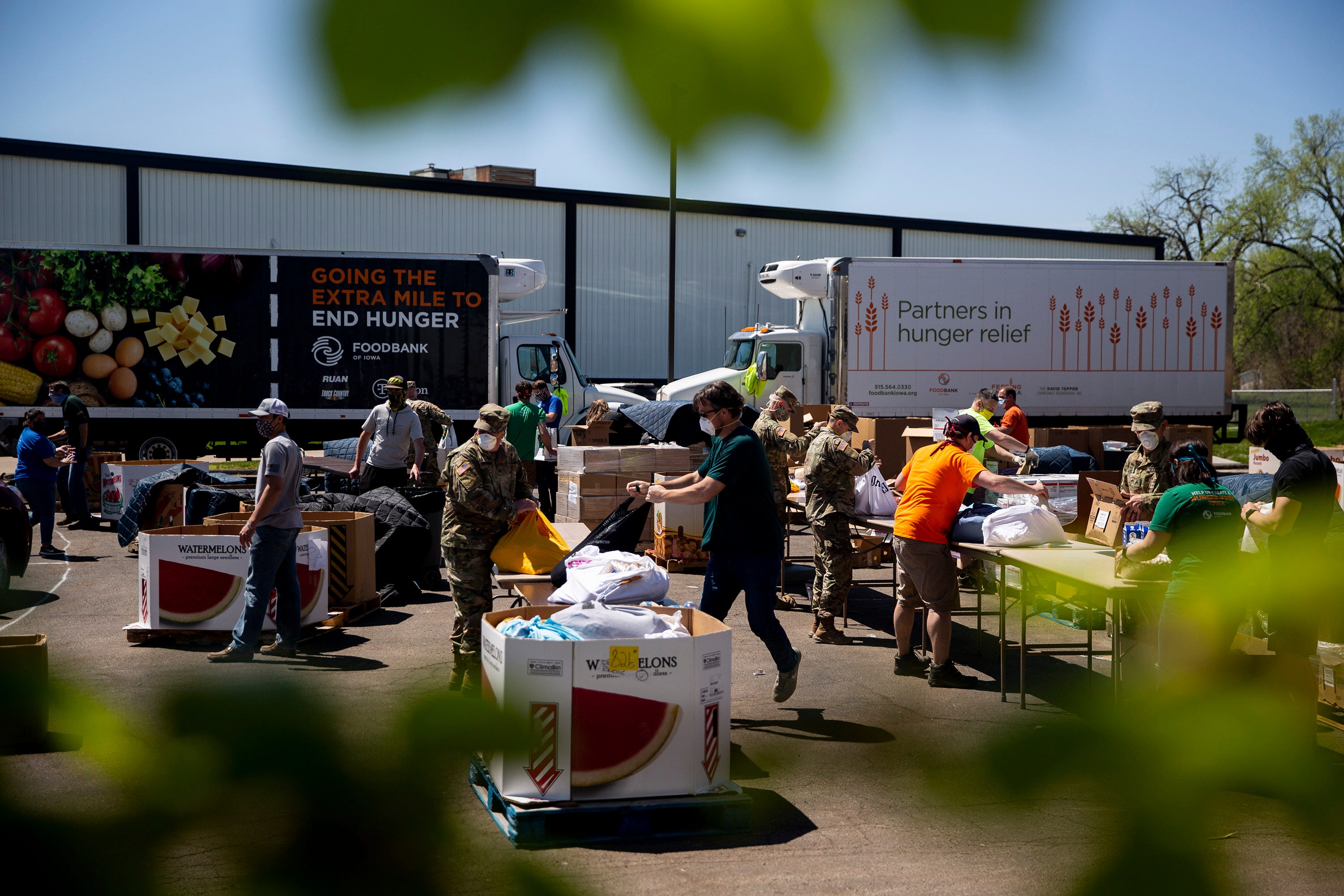 Members of the Iowa National Guard help distribute food from the Food Bank of Iowa on Thursday, April 30, 2020, in Des Moines, Iowa. 