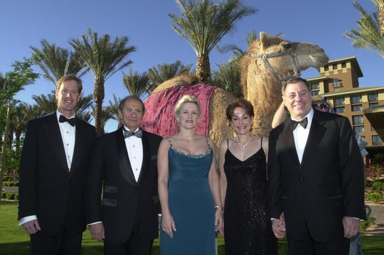 From left, Michael White, Mort Fleisher, Penny Nissley, Karen Baum, and Herb Baum stand with a camel that was donated by the Dial Corp. for use in a charity dinner and auction to raise money to fight diabetes on March 30, 2003.
