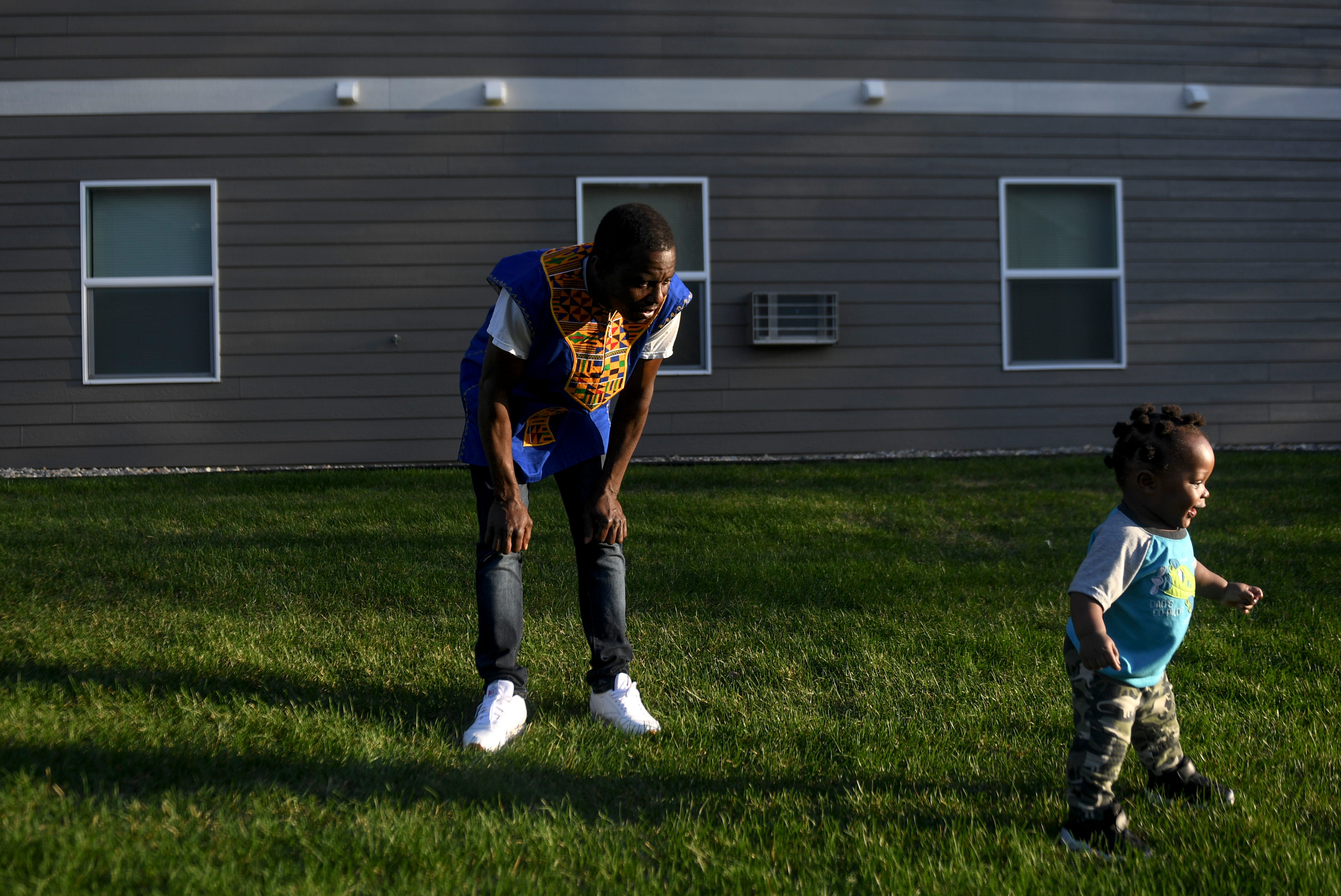 John Deranamie spends time with his youngest son, Nehemiah Deranamie, 1, on Wednesday, April 29, 2020, at his home in Sioux Falls, S.D. Deranamie, a Smithfield Foods employee, tested positive for COVID-19 and has been spending time at home with family since the meatpacking plant shut down.
