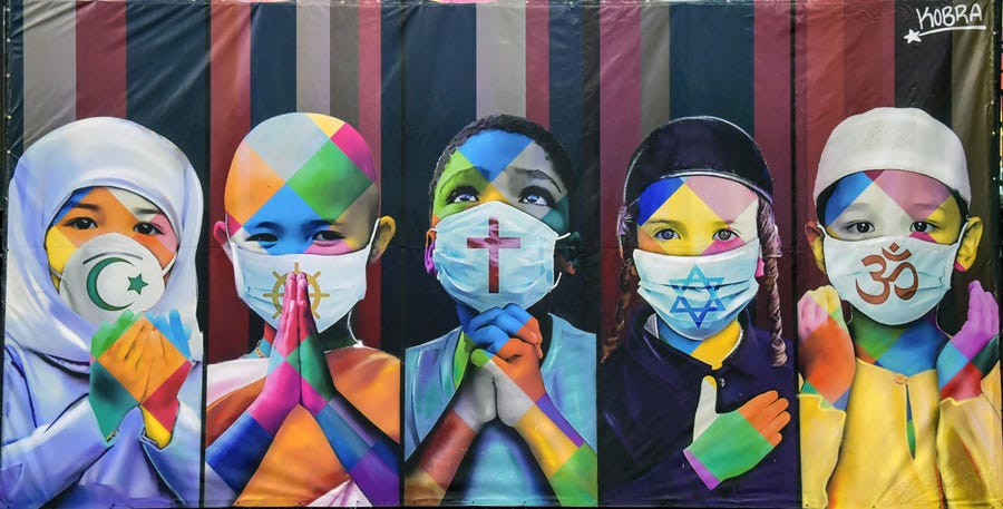 View of Brazilian mural artist Eduardo Kobra's recent work "Coexistence," which shows children wearing face masks due to the new coronavirus bearing symbols of different religions in Itu, Brazil.