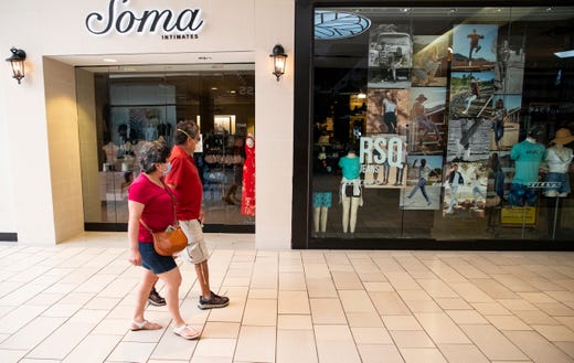 People walk thought the La Palmera Mall on Friday, May 1, 2020 the first day it has been open since the COVID-19 outbreak. 