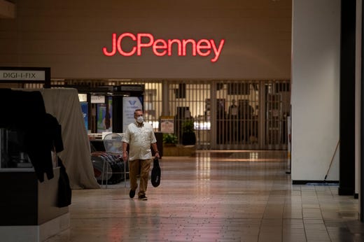A man waring a mask walks thought the La Palmera Mall on Friday, May 1, 2020 the first day it has been open since the COVID-19 outbreak. 