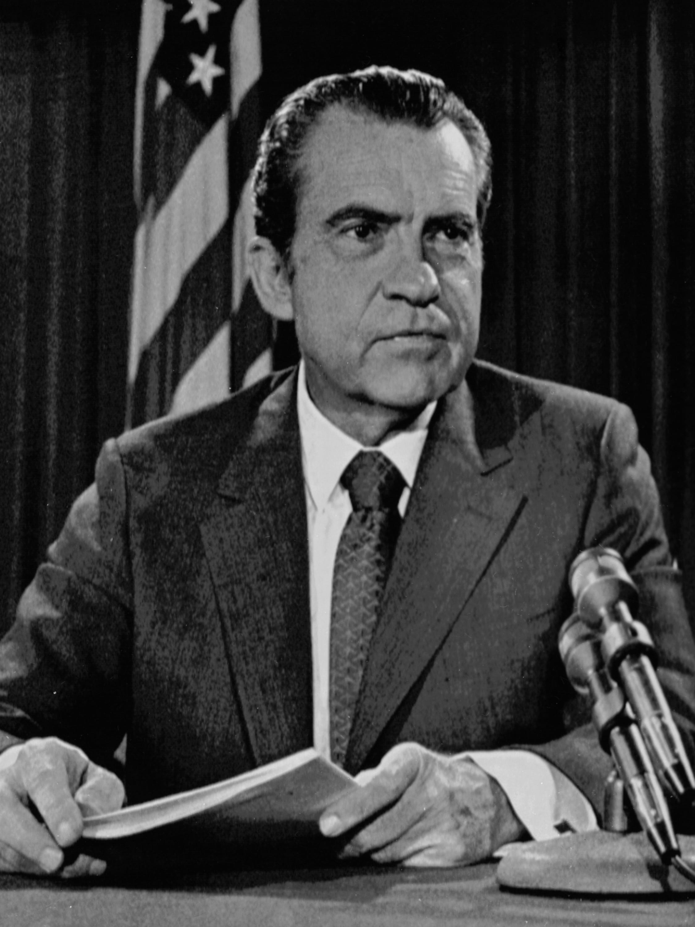 American President Richard Nixon poses for pictures in his White House office, on Aug. 15, 1971, after a nationwide television speech which dealt with economic policies.