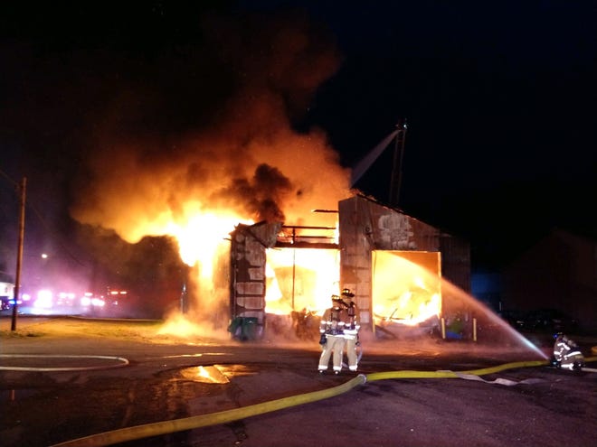 Newark Fire personnel fight a blaze at a building on McKinley Avenue on Thursday night.