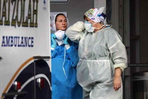 Medical workers take in patients outside of a special coronavirus intake area at Maimonides Medical Center on May 01, 2020 in the Borough Park neighborhood of the Brooklyn borough of New York City. Hospitals in New York City, which have been especially hard hit by the coronavirus, are just beginning to see a downturn in COVID-19 cases.