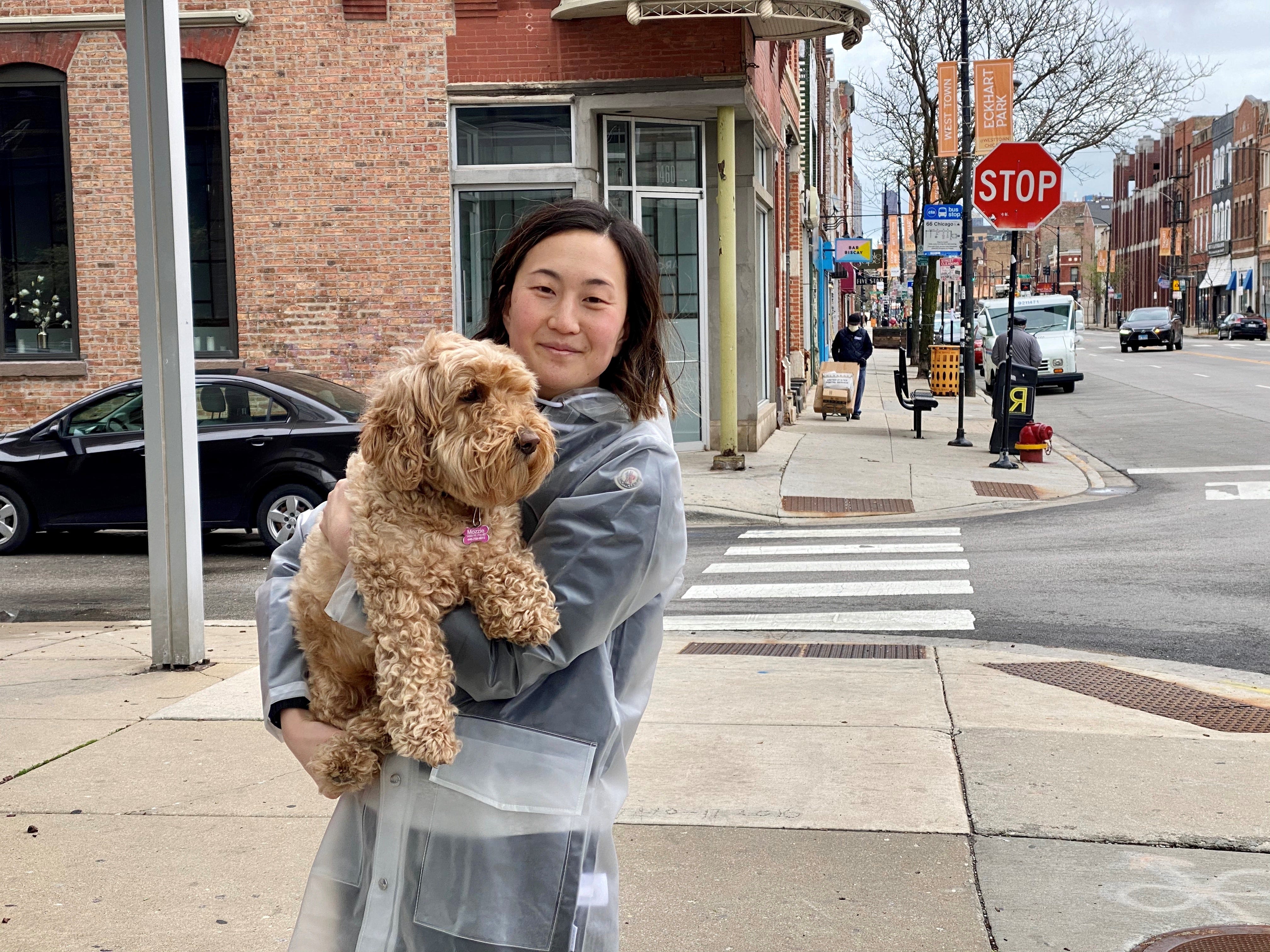 Noble Square resident Jane Kwak, 32, walks her goldendoodle, Mozzarella, in Chicago on April 30, 2020.