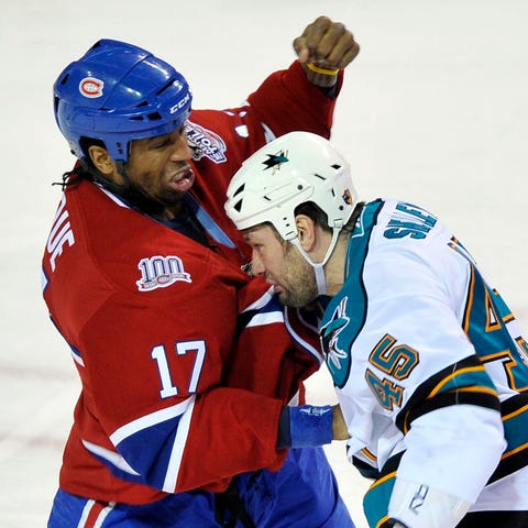 Georges Laraque, left, former NHL player