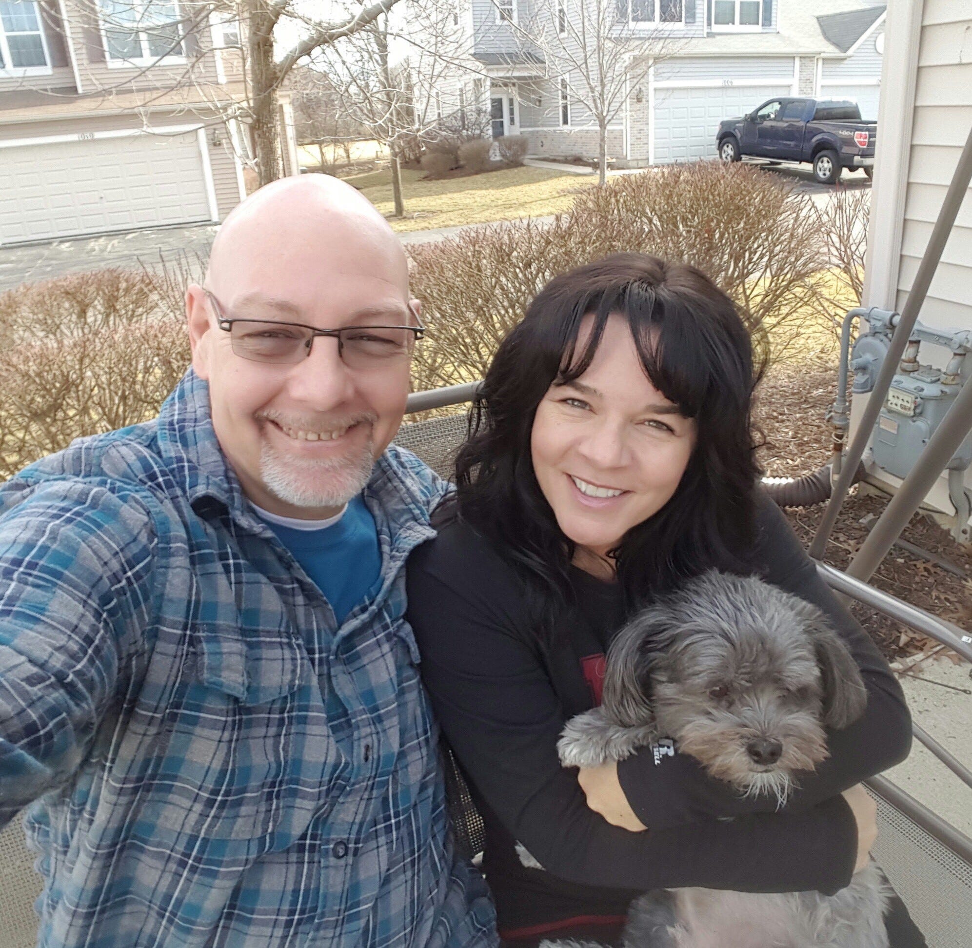 Kyle Brown, Pamela Dennen and their dog, Bear. Brown died from COVID-19 complications in late April.