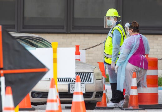 Heath care workers conduct COVID-19 testing at the Corpus Christi's drive-thru testing center at the old Christus Spohn Memorial Hospital parking lot on Monday, May 4, 2020.