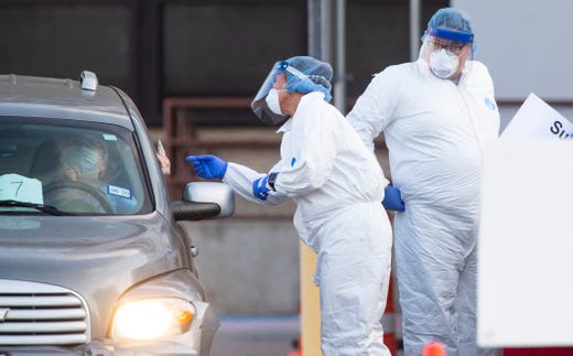 Heath care workers conduct COVID-19 testing at the Corpus Christi's drive-thru testing center at the old Christus Spohn Memorial Hospital parking lot on Monday, May 4, 2020.