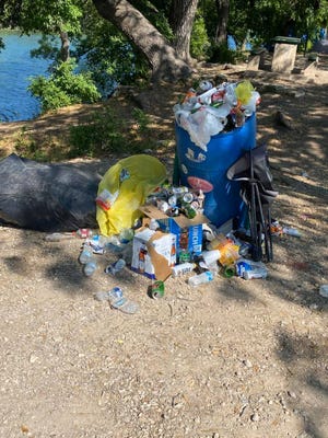 Christoval city officials discovered overflowing trash cans and litter around Pugh Park Monday, after over 1,000 people visited South Concho River over the weekend.