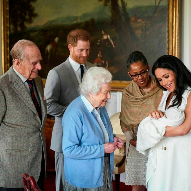 Prince Harry and Duchess Meghan, joined by her mother, Doria Ragland, show their new son to Queen Elizabeth II and Prince Philip at Windsor Castle, May 8, 2019.