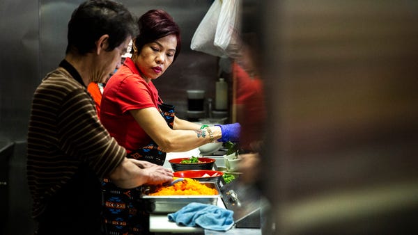 Brenda Tran, owner of the Vietnam Cafe, works in t