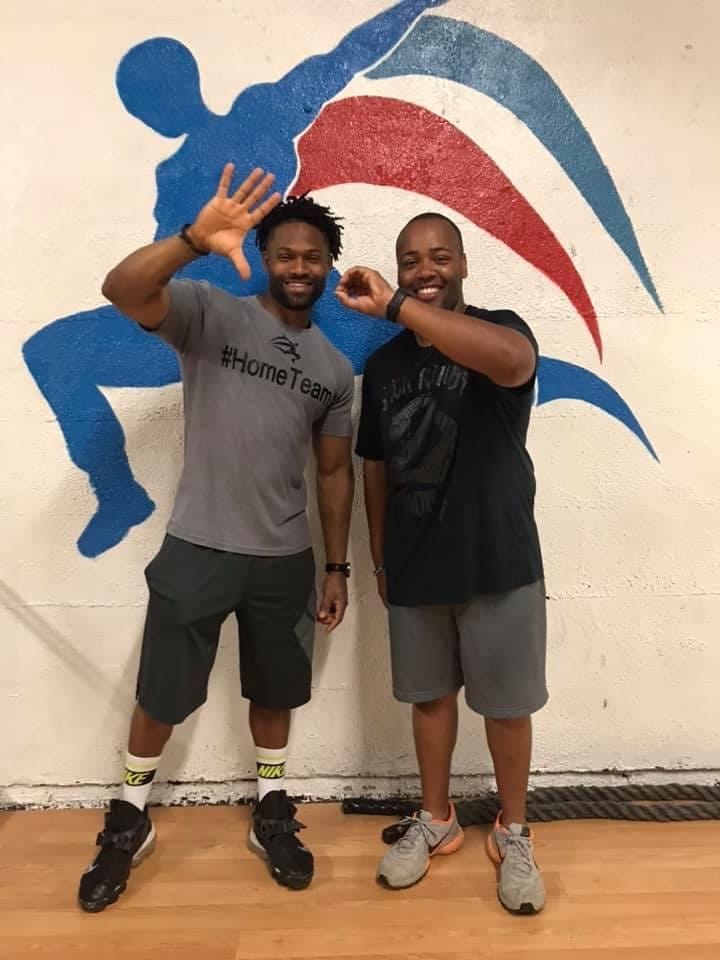 Posing for "50" photo with trainer, Djuan Means, after losing 50 pounds.