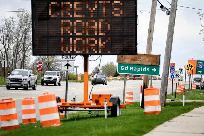 Signs alert motorists to the coming construction on the Creyts Road bridge over Interstate-496 on Tuesday, May 5, 2020.