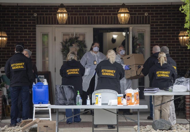 Staff of the Ohio Attorney General's office leave with boxes after conducting a search of Bickford assisted living and  memory care center in Worthington on Tuesday, May 5.