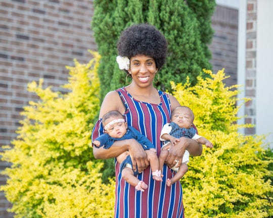 Jazen Morgan holds twins Kalais, left, and Krue, who were born just 24 weeks and two days into her pregnancy.