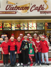 Brenda Tran poses for a holiday photo with her mall walkers, whom she considers her American parents.