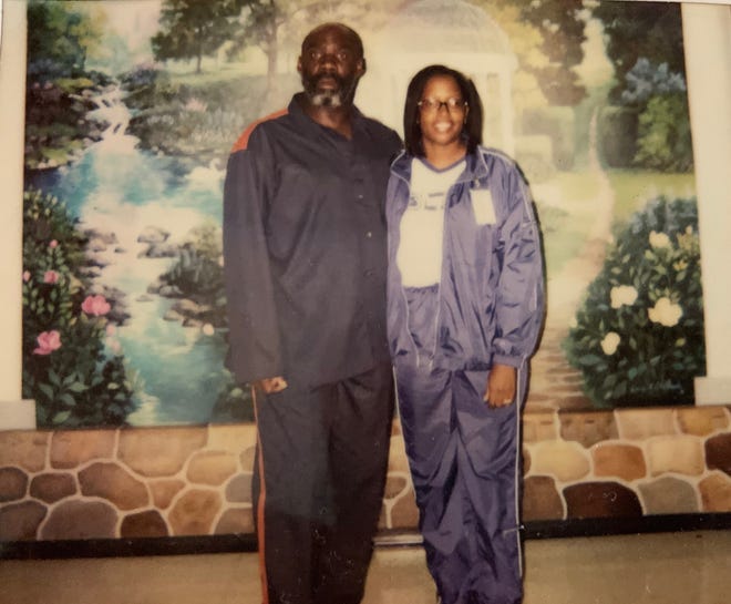 Debra Matthews is pictured with her brother John Thompson during a visit in prison in 2014. Thompson died May 4 of COVID-19.
