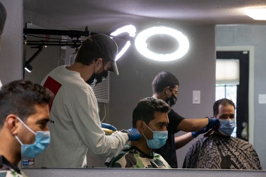 Flawless Barber Shop reopens for business on Friday, May 8, 2020 as part of Texas Gov. Greg Abbott's plan to reopen after coronavirus closures.