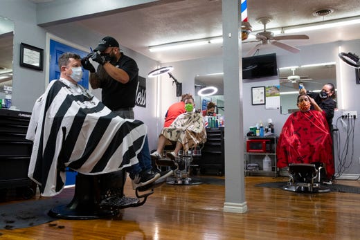 Flawless Barber Shop reopens for business on Friday, May 8, 2020 as part of Texas Gov. Greg Abbott's plan to reopen after coronavirus closures.