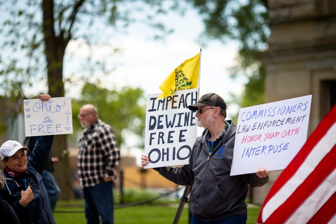 People gather to protest the handling of the pandemic by Governor Mike DeWine and Dr. Amy Acton, director of the Ohio Department of Health, at the Butler County Courthouse in Hamilton, Ohio on Saturday, May 9, 2020.  Free Ohio Now protests happened simultaneously across the state.