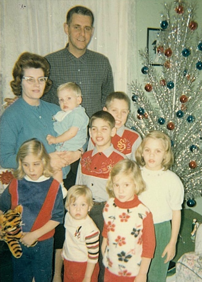 Jim and Marie Jordan pose with their seven children at Christmastime in 1964.