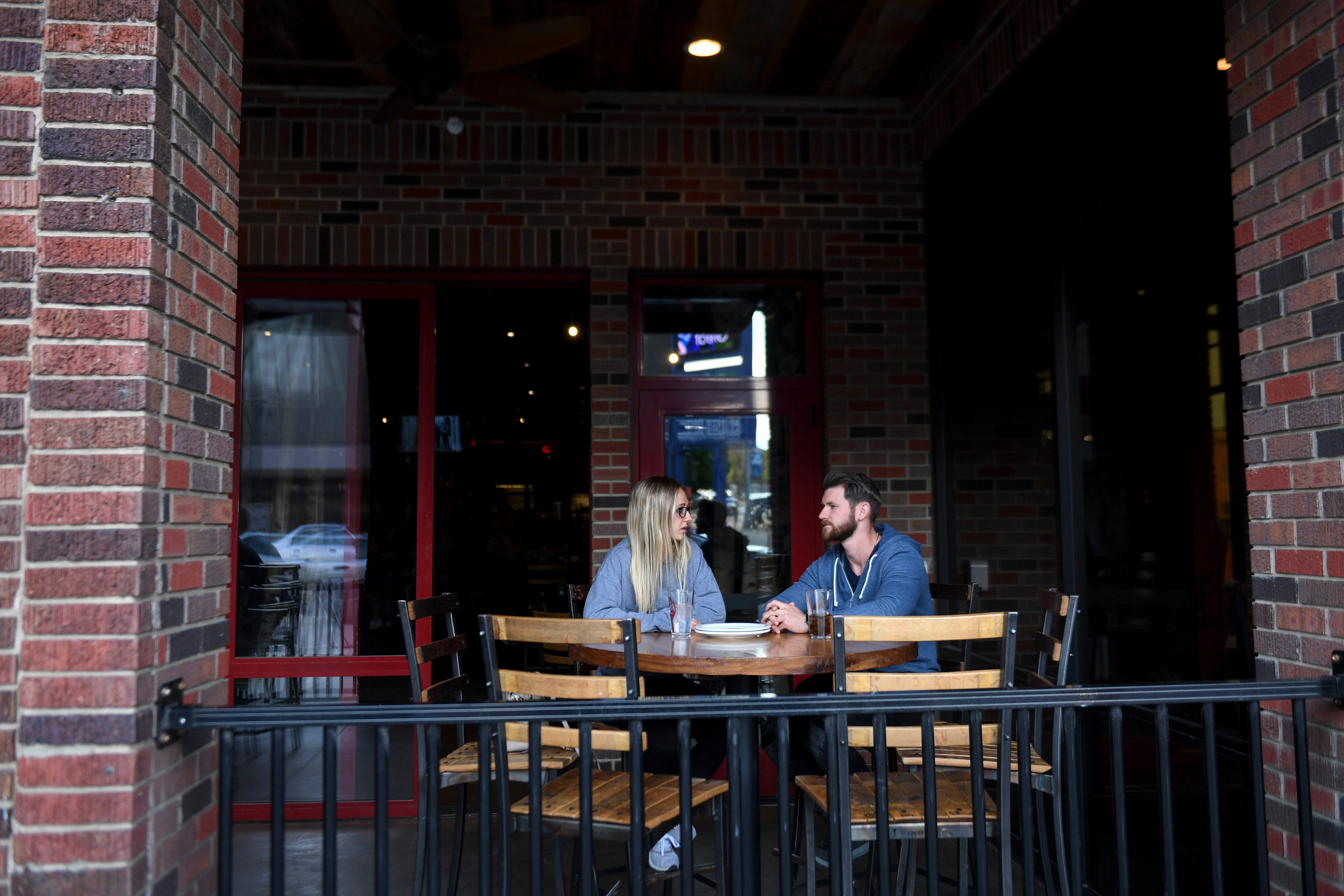 A couple waits for their food at MacKenzie River on Friday, May 8, 2020 in downtown Sioux Falls, S.D. 