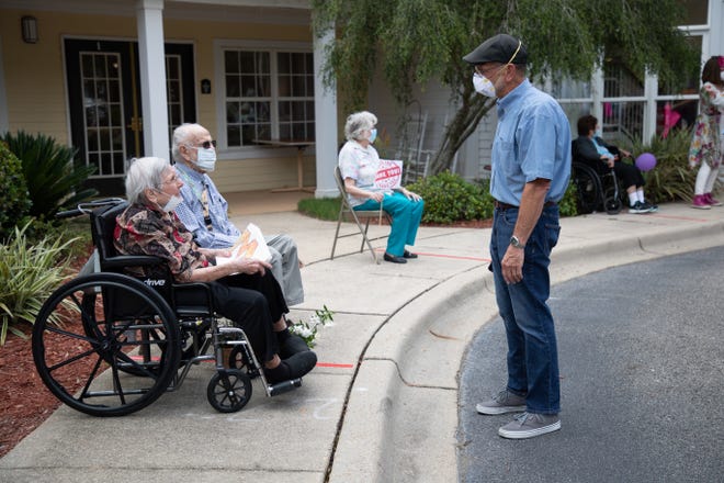 Family members and loved ones of mothers living at Harbor Chase retirement home and memory care center paraded in front of the facility to celebrate Mother's Day Sunday, May 10, 2020. 