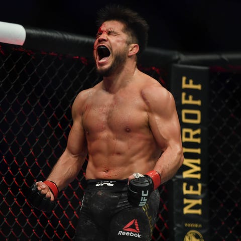Henry Cejudo celebrates after defeating Dominick C