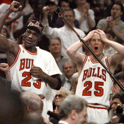 Chicago Bulls players Judd Buechler, left, Michael