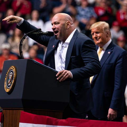 President Donald Trump looks on as UFC president D