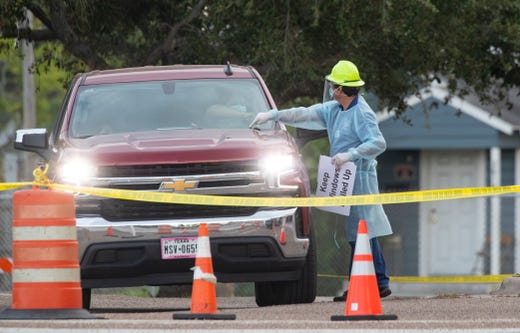 Heath care workers conduct COVID-19 testing at the Corpus Christi's drive-thru testing center at the old Christus Spohn Memorial Hospital parking lot on Monday, May 11, 2020.