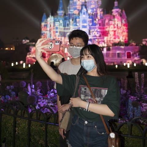 Tourists visit Shanghai Disneyland after its reope
