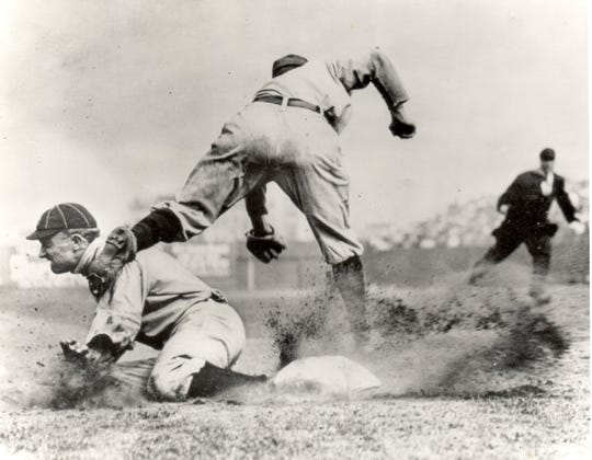 Ty Cobb slides into third in game vs. New York Highlanders. Jimmy Austin is the third baseman at Hilltop Grounds in New York in 1910.