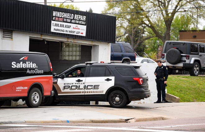 Police report to Safelite Auto Glass after reports of shots fired on Tuesday, May 12, on Minnesota Ave. in Sioux Falls.