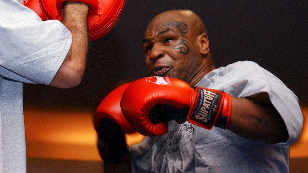 FILE - In this Aug. 30, 2006, file photo, former heavyweight boxing champion Mike Tyson spars during a training exhibition in Las Vegas. Tyson hasn't announced any plans to return to the ring, though he did suggest on an Instagram post he might make himself available for 3 or 4-round exhibitions if the price was right. And already some people in Australia are talking about offering him $1 million to fight an exhibition against a rugby star or two. (AP Photo/Marlene Karas,   File) ORG XMIT: NY171