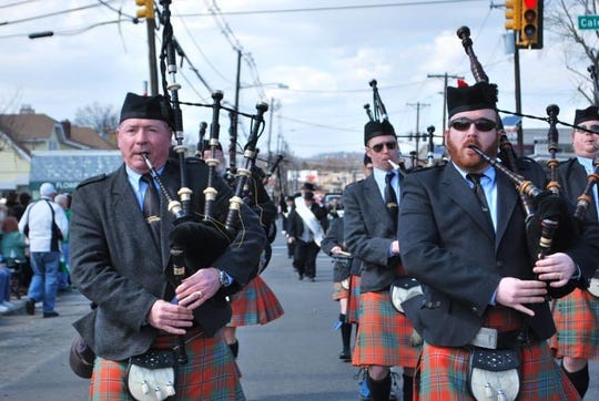 Mike Glackin, right, and his father, Matt, left perform with the St. Columcille United Gaelic Pipe Band during a Union County St. Patrick's Day Parade.