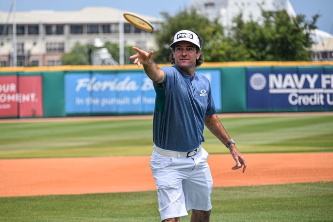 Masters champion and Pensacola Blue Wahoos co-owner Bubba Watson plays disc golf at the unveiling of the course he designed during the COVID-19 pandemic in May 2020.
