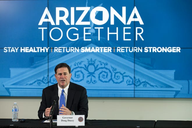 Arizona Gov. Doug Ducey speaks at a press conference about updates to COVID-19 restrictions in Arizona at the Arizona Commerce Authority conference center in Phoenix, Ariz. on May 12, 2020.