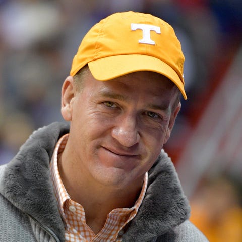 Peyton Manning attends the college basketball game