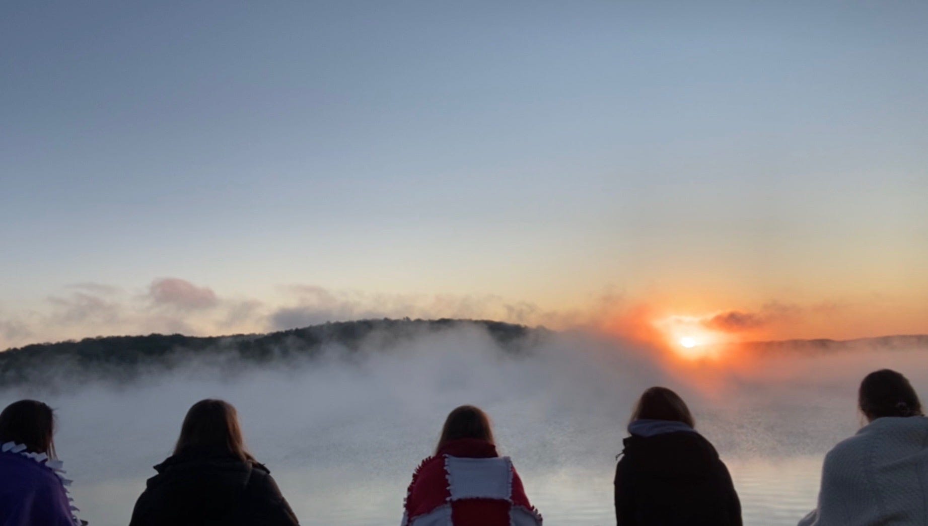 Five college best friends from Indiana University found a way to celebrate on the day graduation was canceled. They gathered at sunrise May 9 on the rocky shore of Lake Monroe in Bloomington, Indiana.