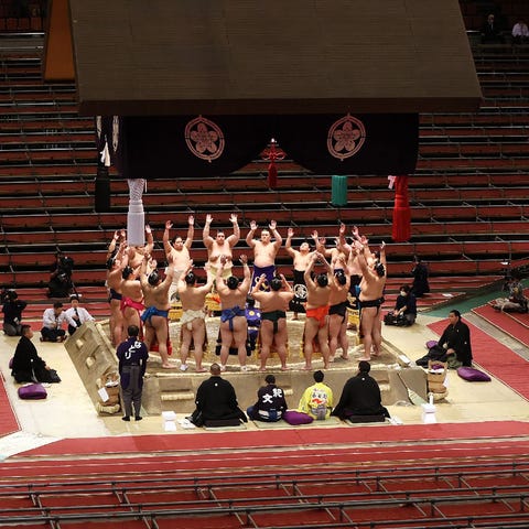 Sumo wrestlers attend the spring grand sumo tourna