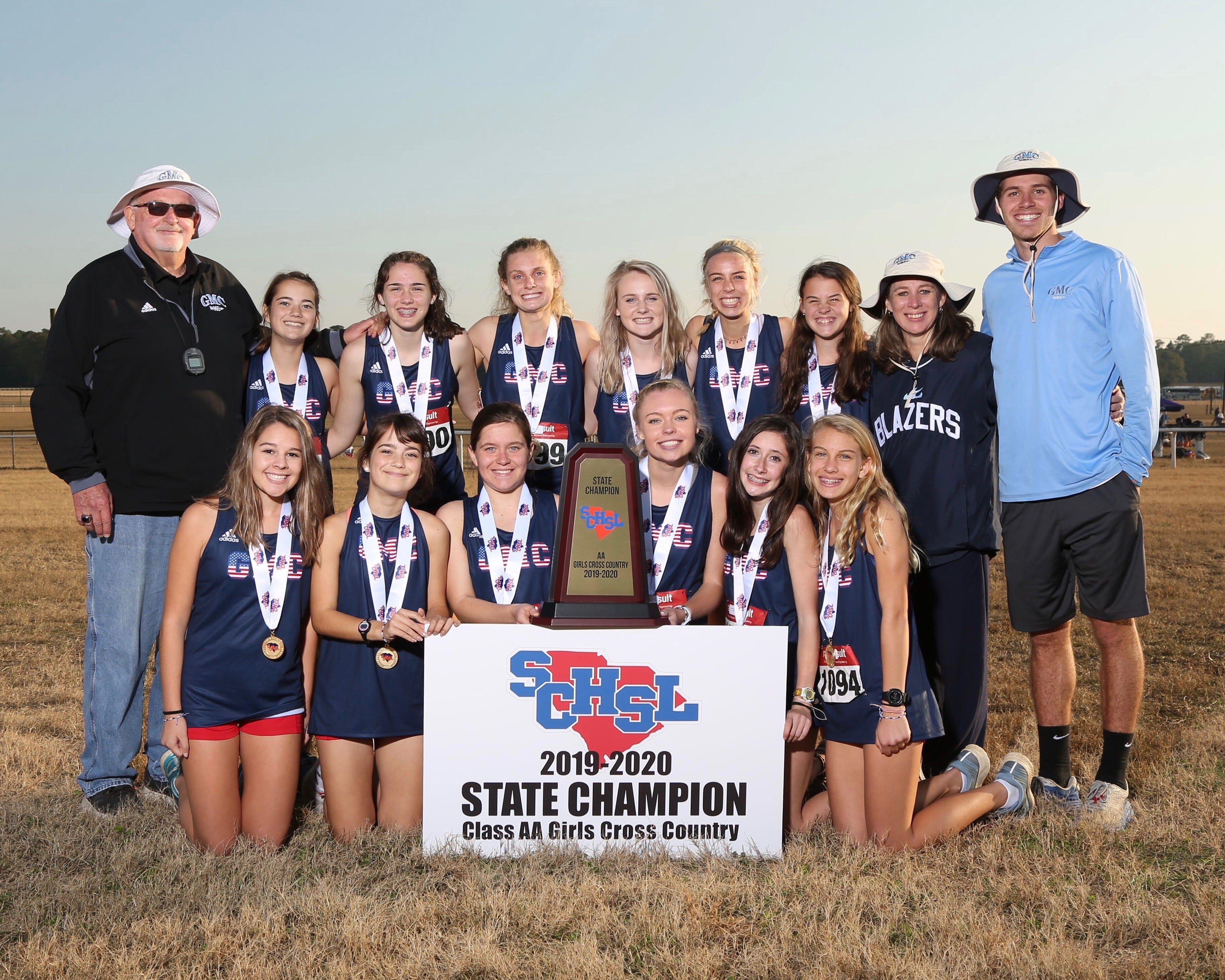 Members of the state champion Greer Middle College Charter girls cross country team were, front row, from left, Sydney Dentler, Kelsey Smith, Alina Pashchuk, Leah Trusty, Hattie Jennings, Margo Norvell; back row, from left, coach David Smith, Bree Smith, Hayden Williams, Julina White, Nora Finnegan, Lilly Norvell, Catherine Taylor, coach Angie Dentler, coach Micah Williams.