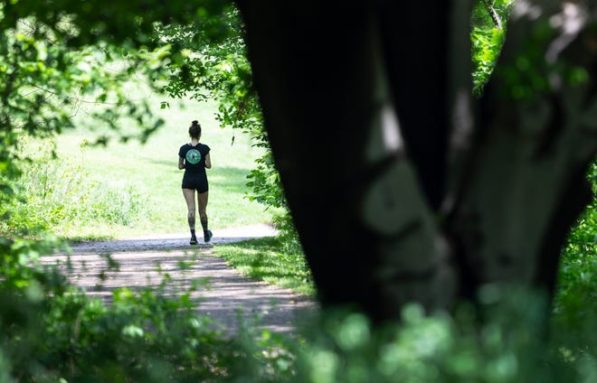 People flocked to Cherokee Park in Louisville, Kentucky during a break in the rain to exercise on the park's trails. May 14, 2020