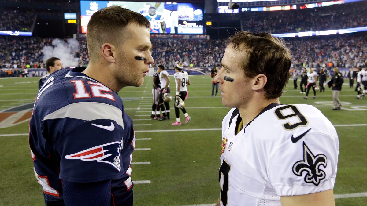 New England Patriots quarterback Tom Brady, left, talks with New Orleans Saints quarterback Drew Brees after the Patriots beat the Saints 30-27 in an NFL football game Sunday, Oct.13, 2013, in Foxborough, Mass.