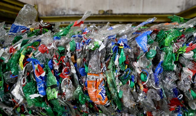 Flattened plastic bottles in one area of Schupan Recycling in Wixom, Michigan on Friday May 15, 2020 have been sitting for the past two months with nowhere to go. Most of the recycle center has not been active because of the Coronavirus and people not being able to recycle bottles at grocery stores which end up coming here for processing.