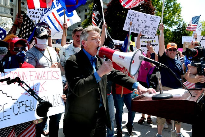 Protesters broke through barriers to gather around speaker, State Rep. Russ Diamond, R-Lebanon, who gave a speech during a Reopen PA rally in Harrisburg Friday, May 15, 2020. About 1,000 protesters participated at the rally in front of the capitol building. Bill Kalina photo 