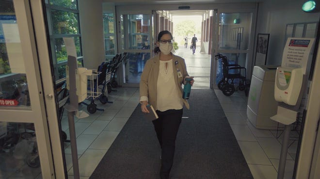 Employees at Dixie Regional Medical Center are checked for masks and temperatures on their way into work Tuesday, May 12, 2020.