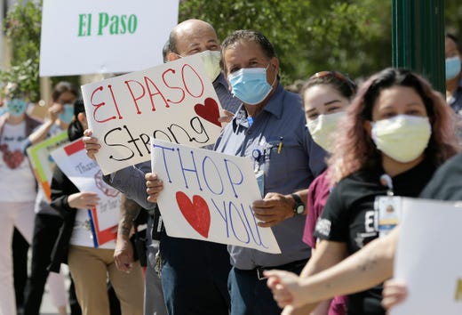Staff at The Hospitals of Providence Memorial Campus held a 'Thank You El Paso' parade Friday to thank the city for their support of healthcare workers and to thanks EMS workers. Staff stood in front of the hospital with signs dancing and shouting to passing cars and ambulances.